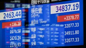 An electronic quotation board displays share prices on the Tokyo Stock Exchange in Tokyo.