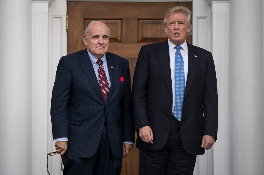 Giuliani stands with president-elect Donald Trump before their meeting at Trump International Golf Club on Nov. 20, 2016 in Bedminster, N.J.