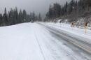 Mountain road covered in snow.