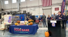 Regional Food Bank CEO Tom Nardacci announcing the food bank's Thanksgiving meal distribution initiative at the Institute for Advanced Manufacturing at Clinton Community College.
