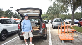 Chris Ansley, of Wesley Chapel, loads plywood into the trunk of his SUV. He said it's the first time in 25 years that he has boarded up his windows ahead of a hurricane.