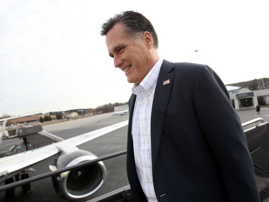 Republican presidential hopeful Mitt Romney boards his campaign plane in Bedford, Mass., on Wednesday, heading for South Carolina. Romney brings momentum from Iowa and New Hampshire, but South Carolina is new terrain — a place where Romney is going to have to appeal to religious conservatives and Tea Party voters. 