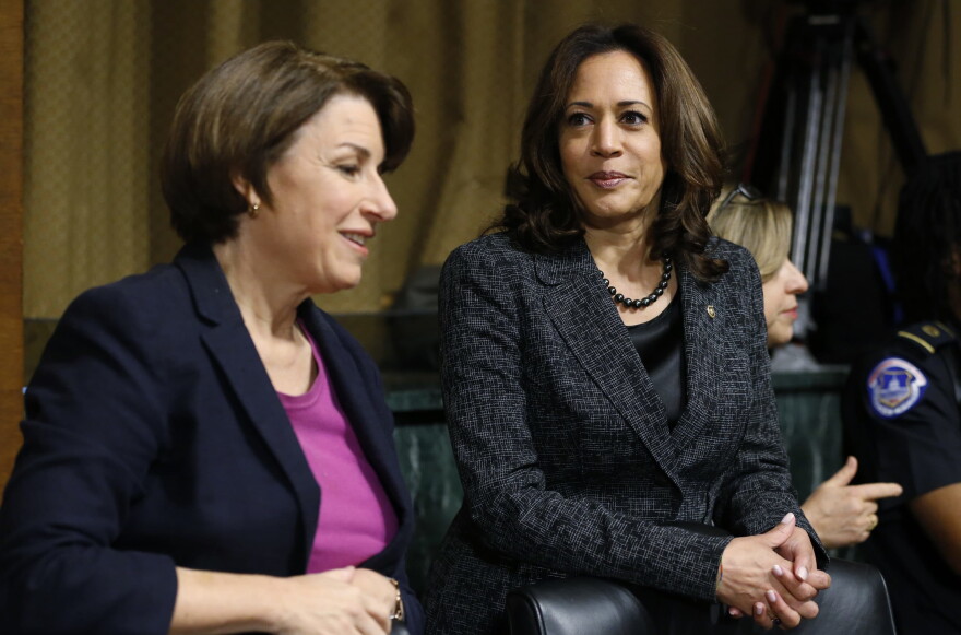 Senators Amy Klobuchar (left) and Kamala Harris talk before the Senate Judiciary Committee hearing with Christine Blasey Ford on Thursday, Sept. 27, 2018. (Michael Reynolds/Pool Image via AP)