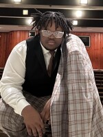 Judah White midshot in theatre seats