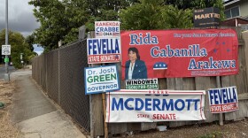  Campaign signs for the 2026 primary election are displayed on a wall in ʻEwa Beach, Hawaiʻi on Tuesday, Aug. 4, 2026.