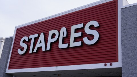 The Staples logo is displayed on the facade of a store, Monday, Feb. 6, 2023, in Manchester, N.H.