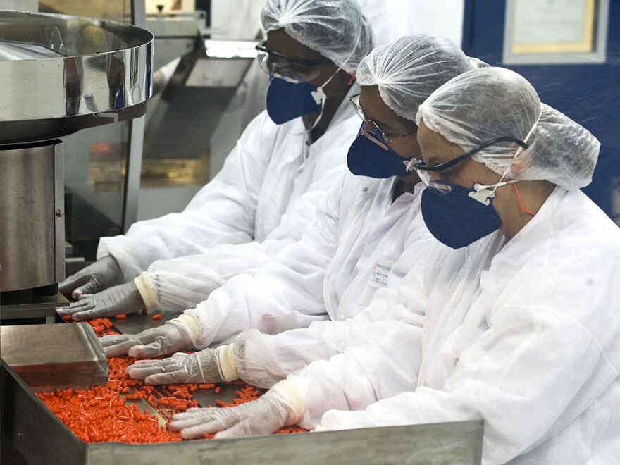 <strong>Widespread Problem</strong>: India isn't the only country with its own version of Tamiflu. Here, workers at a lab owned by the Brazilian government sort pills of Oseltamivir, the drug with the trade name Tamiflu.