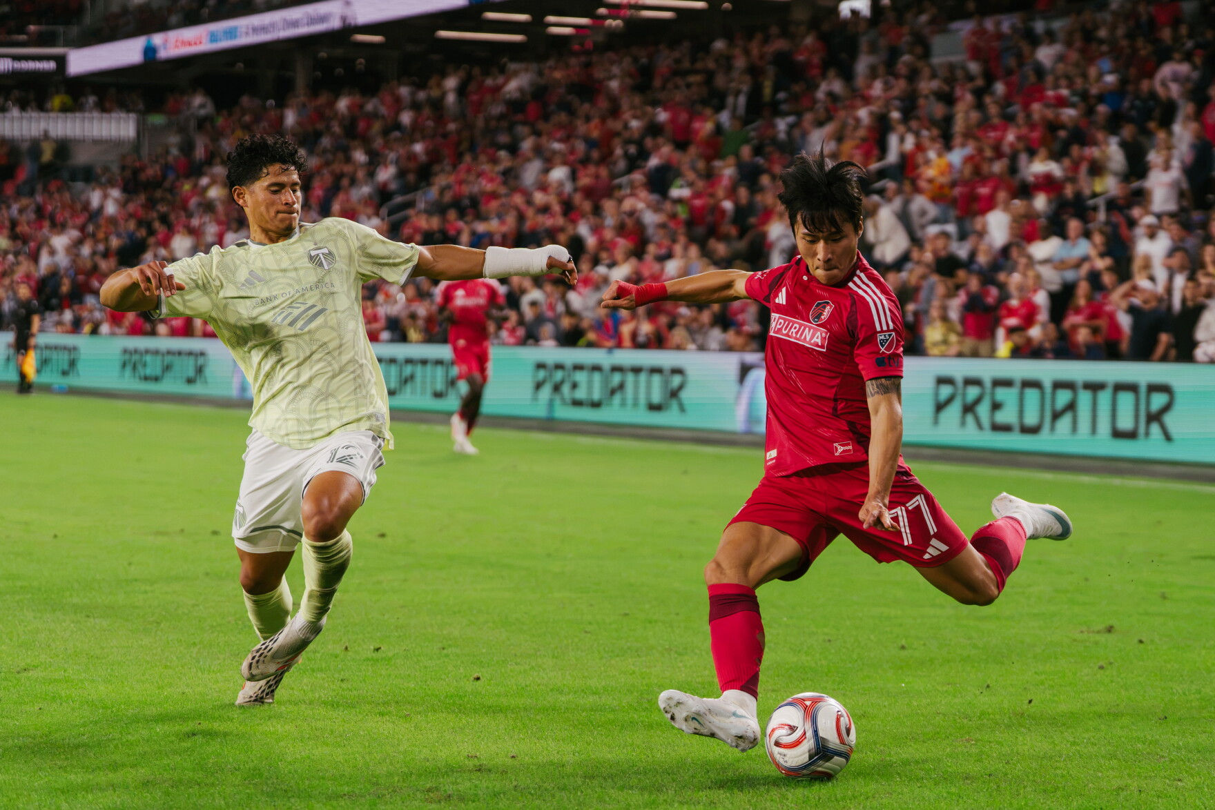 St. Louis City SC forward Sangbin Jeong (#77) kicks the ball past Portland Timbers defender Ronald Hernández (#12) — and scores — during their match on Wednesday, Oct. 28, 2026, at Energizer Park in St. Louis’ Downtown West neighborhood.