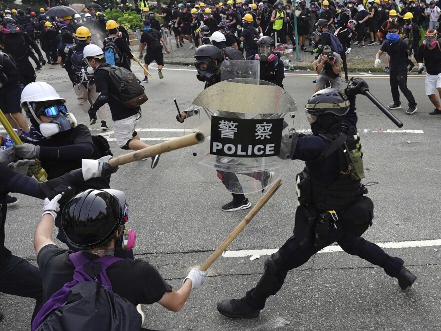 Police and pro-democracy demonstrators clashed during a protest in Hong Kong on Saturday. Protests began in June over an unpopular bill that would have allowed extraditions to mainland China.