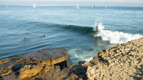 A surfer rides a wave at Steamer Lane, one of the spots that surfers say erosion is changing.