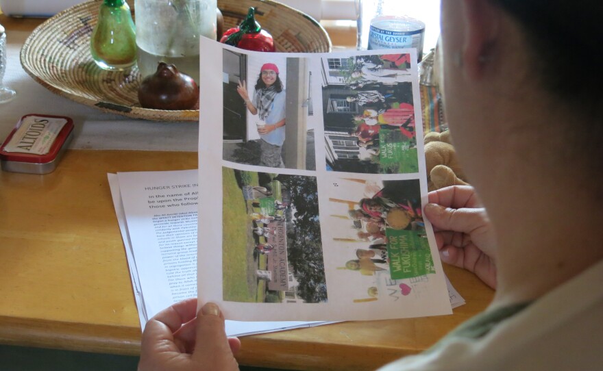 Shelley MacInnes, holding pictures of her son, Alex Ciccolo, who faces domestic terrorism charges.
