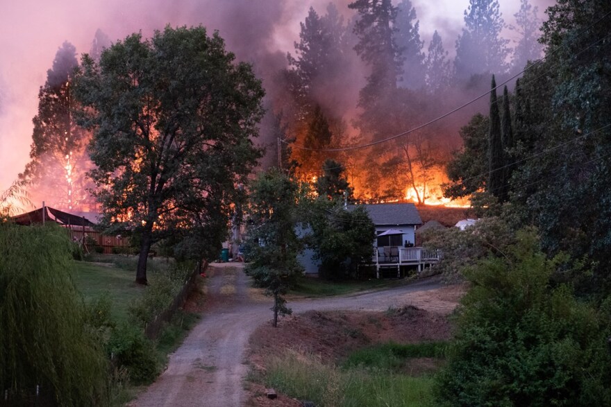 Homes on Mount Olive Rd are threatened by flames from the River Fire Wednesday, Aug. 4, 2021.