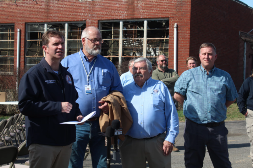 Kentucky Gov. Andy Beshear speaks Sunday in front of Freemont Baptist Mission in McCracken County, not far from the path of an EF-2 tornado that hit the small community Friday. The tornado was part of a storm system that devastated Kentucky, killing five and leaving over a half million people without power at the height of the outages.