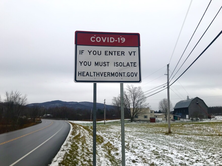 A sign reading COVID-19 If You Enter VT You Must Isolate HealthVermont.Gov