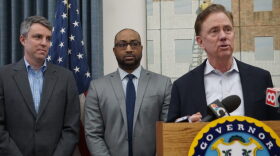 Gov. Ned Lamont introducing Paul Mounds, center, as chief of staff, and Josh Geballe, left, as chief operating officer.