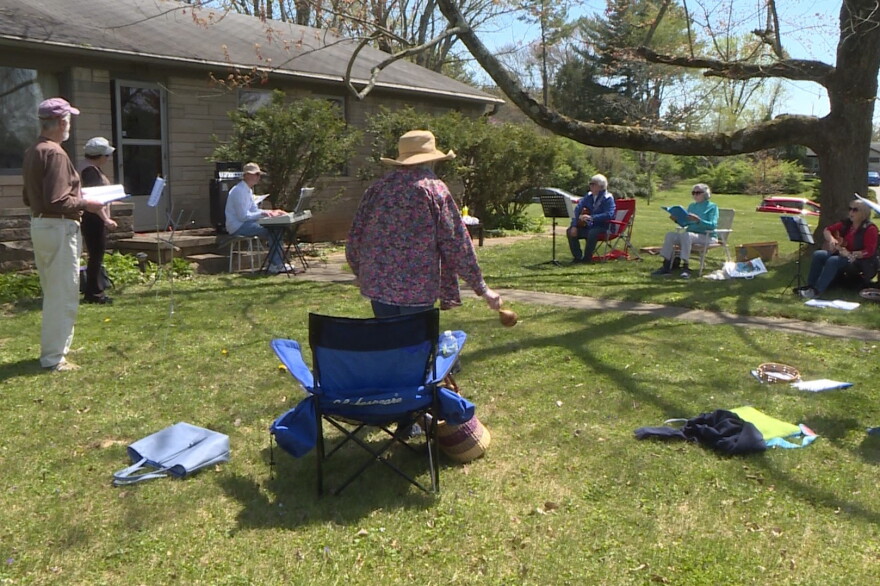 Pianist Mark Wiedenmayer plays with members of the Music Ministry group at his home in Bloomington.