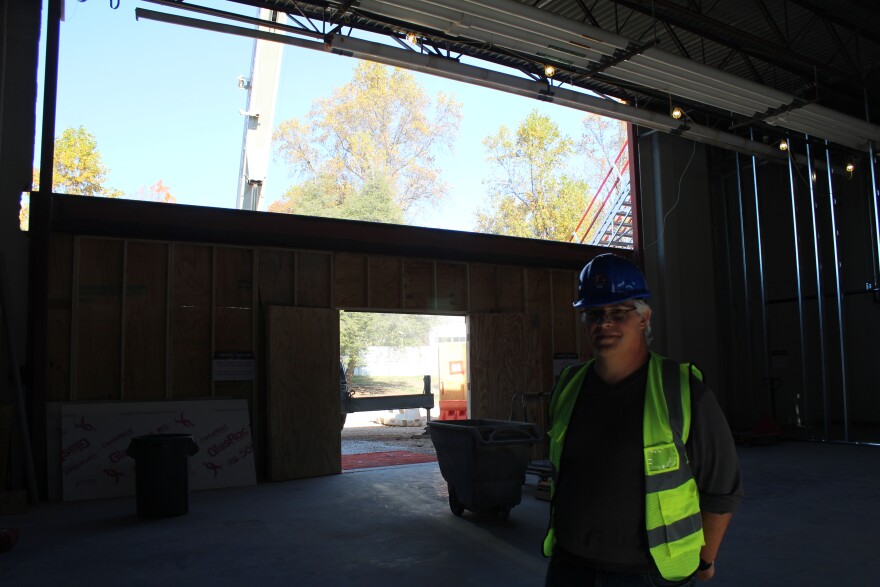 Nick Nelson stands in front of what will be new windows in the old auditorium of the Springfield Art Museum in November 2025.