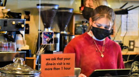 A young worker takes orders at the Blackbird Cafe in Valparaiso.