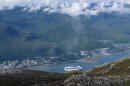 A cruise ship approaches its stop in downtown Juneau, Alaska, as glimpsed from along the Mount Roberts trail. (Becky Bohrer/AP)