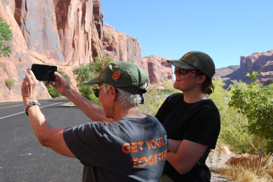 Smith takes a photo of one of her assigned sites while Blumhardt, the program’s engagement specialist, looks on.