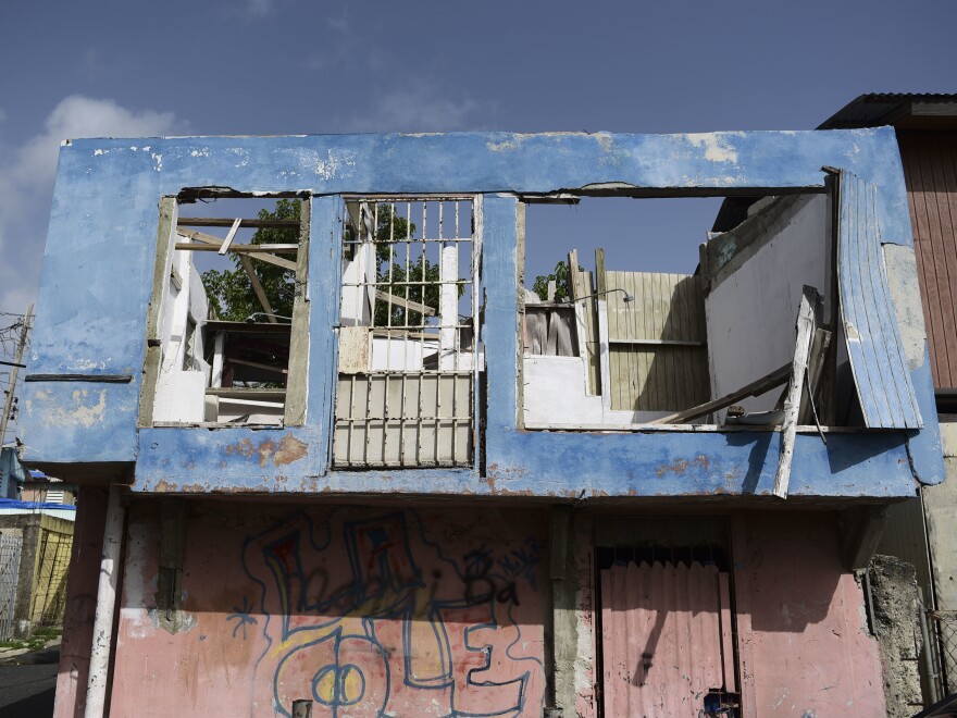 In this June 13 photo, a residence in the Figueroa neighborhood stands destroyed nine months after Hurricane Maria, in San Juan, Puerto Rico. On Wednesday a federal judge extended a temporary housing program for territory residents whose homes were destroyed.