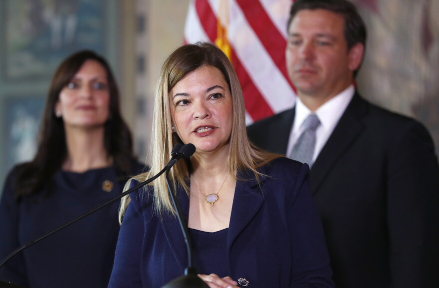 Barbara Lagoa, center, Governor Ron DeSantis' pick for the Florida Supreme Court, speaks after being introduced, as DeSantis and Lt. Gov Jeanette Nunez, left, look on, Wednesday, Jan. 9, 2019, in Miami.