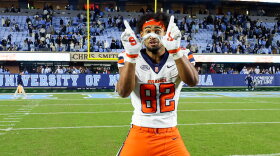 Linebacker Jamie Tremble (82, White) celebrates a victory over UNC on Saturday.