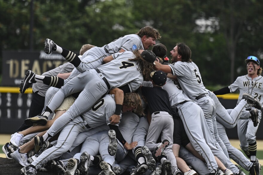 Wake Forest celebrates after winning an NCAA college baseball tournament super regional game against Alabama, Sunday, June 11, 2023, in Winston-Salem, N.C.