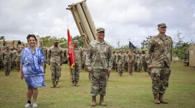 From left, Guam Gov. Lou Leon Guerrero, Brig. Gen. Michael Cruz, adjutant general, Guam National Guard, and Lt. Col. Jonathan Stafford, commander, Task Force Talon, visit with troops at the Terminal High Altitude Area Defense (THAAD) site, Guam, May 9, 2024.