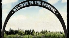 Book cover image of gates next to an empty field with an arched banner reading "Welcome to the Festival"