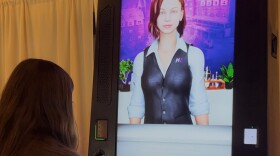 Cecilia (right), the AI bartender, is able to check ID, mix cocktails and communicate with customers. She was on display Tuesday at the annual Hospitality Maine summit at Sugarloaf Mountain Resort.