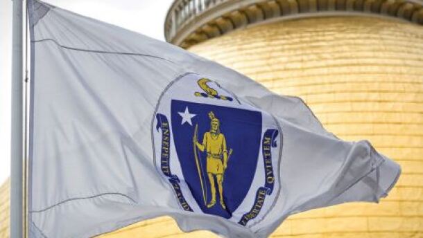 Momentum is building to change the Massachusetts state flag. The flag includes an image of an arm in colonial dress holding a sword over an Indigenous person.