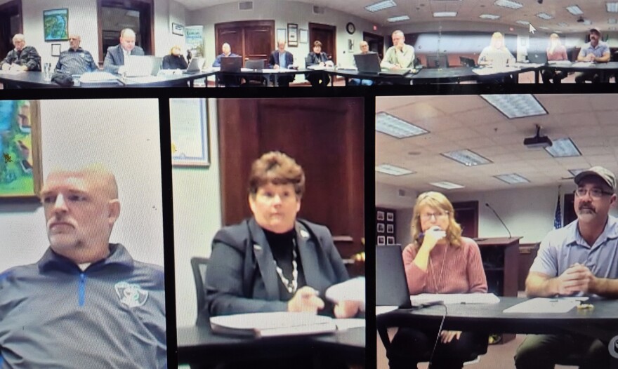 Eaton Rapids Police Chief Larry Weeks, lower far left, listens to others during the city council's Monday work session. Mayor Pamela Colestock is pictured in the lower middle frame.