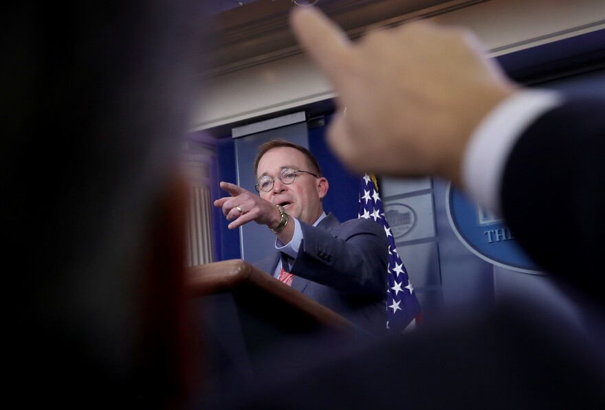 Acting White House chief of staff Mick Mulvaney answers questions during a press conference on Oct. 17.