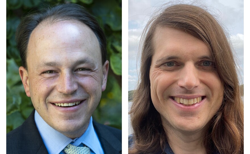 A split screen of two smiling men: The man at left has short dark hair and is wearing a dark blazer, a light blue collared shirt, and a green polka dot tie; the man at right has long brown hair and is wearing a blue jacket. 