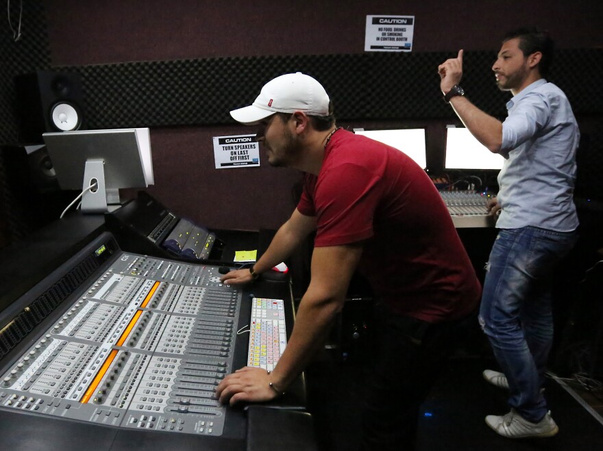 Libyan technicians work at the studio of Radio Zone in 2012, in Tripoli. The station's presenters are not afraid to speak out against militias formed in the uprising against Gadhafi, and continue to challenge the post-revolutionary government.