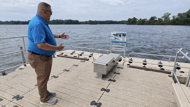 Man shows off an accessible boat launch.
