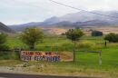 The Rocky Canyon Fire smolders in the cliffs and hills above Henefer Aug. 13, 2026.