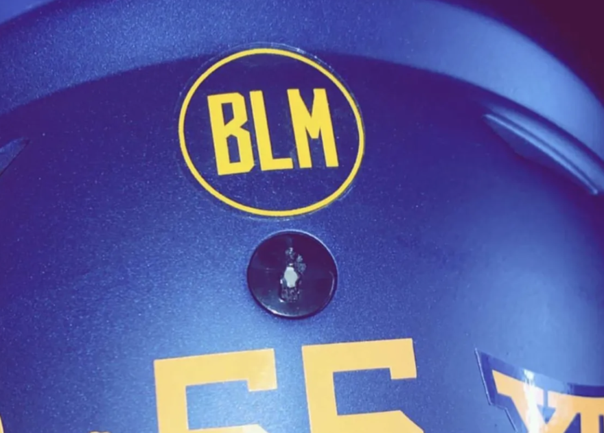 A sticker in support of Black Lives Matter can be seen in this cropped photo posted by West Virginia University defensive lineman Dante Stills to his Instagram account.