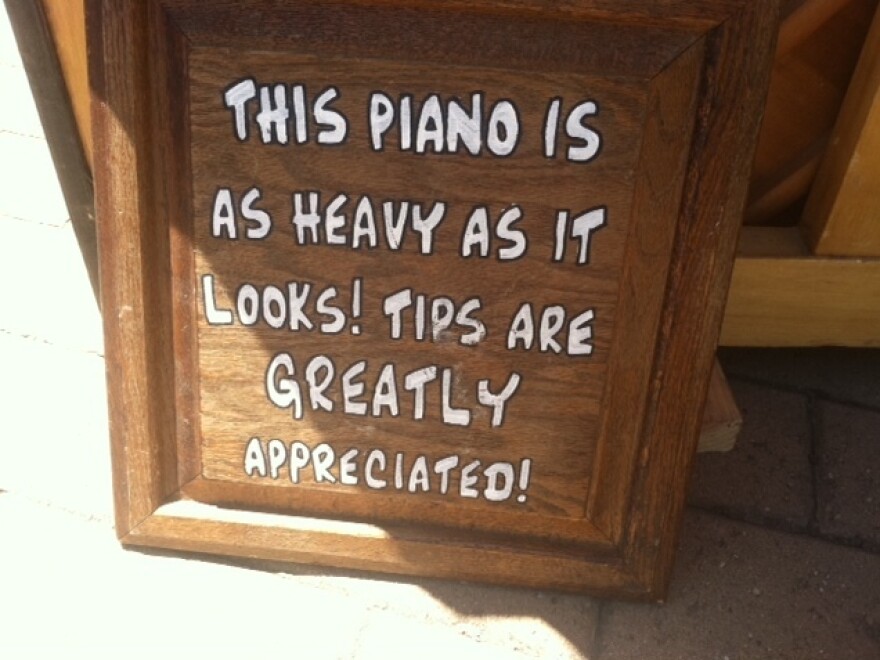 Alexander says performing outdoors with a real piano attracts "a lot of pity tips."