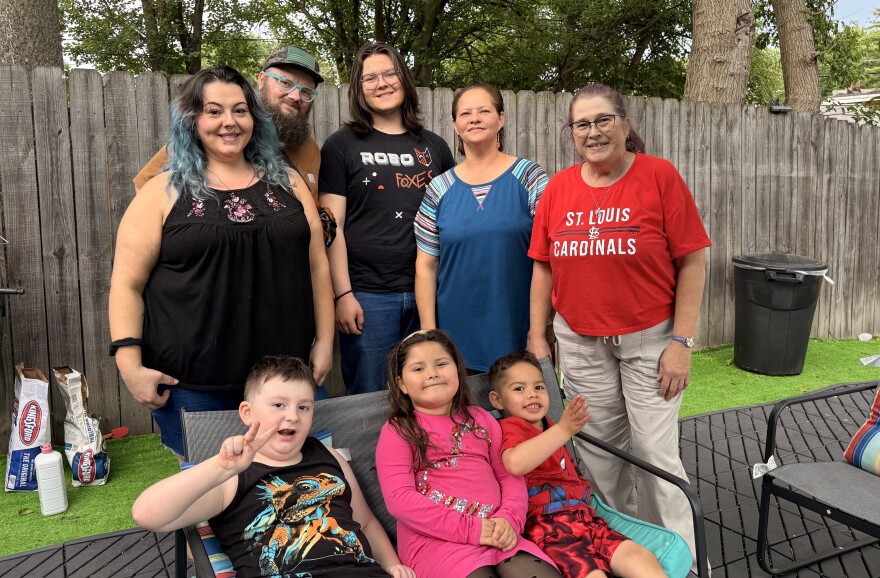 Rachel Baltazar, blue top, and family celebrate the life of her husband, Juan Baltazar, on May 16 in south St. Louis. He was killed in a storm one year ago. Back row, from left: Jenny Hartley, Nick Brown, Martin Baltazar, Rachel Baltazar and Shardon Crider.  Bottom row, from left: Aspen Brown, Rosalia Baltazar and Matias Baltazar.