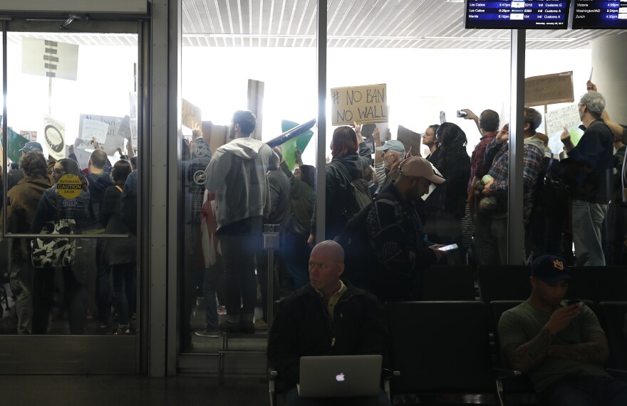 People at the international arrival terminal at San Francisco International Airport protest President Trump's executive order on immigration on Saturday.