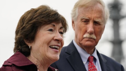 Sen. Susan Collins, R-Maine, speaks to reporters at Bath Iron Works, Saturday, Oct. 2, 2021, in Bath, Maine. Sen. Angus King, I-Maine, stands at right.