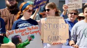 Opponents of barring gun restrictions on college campuses in New Hampshire rally Tuesday before a N.H. Senate hearing on the bill