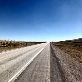 A lonely stretch of road to cycle in Wyoming.
