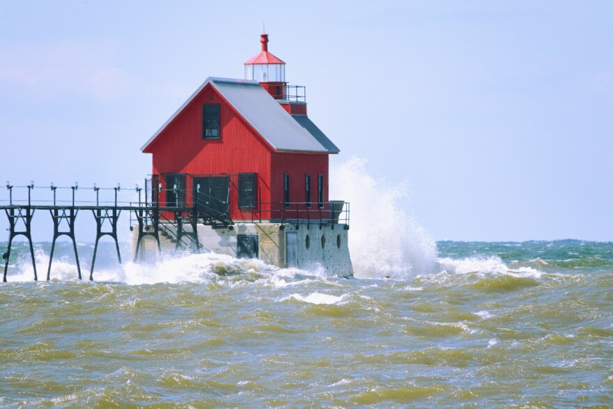 Waves hitting a pier on a lake