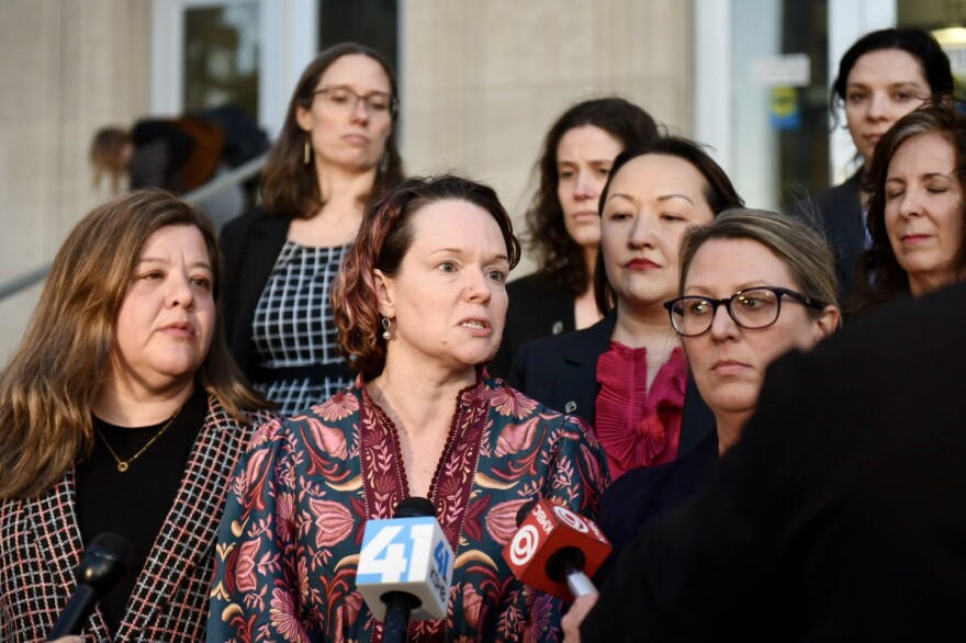 Dr. Margaret Baum (center), chief medical officer with Planned Parenthood Great Rivers, speaks to reporters following the opening day of a trial litigating Missouri’s abortion regulations on Monday, Jan. 12, 2025, in front of the Jackson County courthouse in Kansas City.