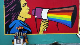 A mural of Dolores Huerta is painted outside a Bakersfield meat market.