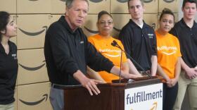 Gov. John Kasich speaks before a tour of Amazon's fulfillment center in Pataskala.