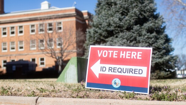 A "vote here" sign directs visitors toward the Sedgwick County Election Office.